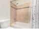 Clean bathroom with tile shower and bathtub at 9255 E Lehigh Ave # 211, Denver, CO 80237