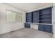 Spacious bedroom with built-in shelving and ample closet space at 9255 E Lehigh Ave # 211, Denver, CO 80237
