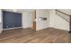 Simple dining area with hardwood floors and blue accent wall at 9255 E Lehigh Ave # 211, Denver, CO 80237