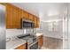 Bright kitchen features stainless steel appliances and granite countertops at 9255 E Lehigh Ave # 211, Denver, CO 80237