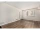 Bright living room with hardwood floors and large window at 9255 E Lehigh Ave # 211, Denver, CO 80237