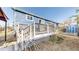 Blue home with a charming deck and backyard space at 8910 Rutgers St, Westminster, CO 80031