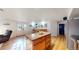 Finished basement offers a bar, island, and access to the backyard at 8910 Rutgers St, Westminster, CO 80031