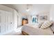 Cozy bedroom featuring neutral carpet, a dresser, and a window overlooking the backyard at 8910 Rutgers St, Westminster, CO 80031