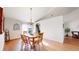 Bright dining room featuring a chandelier and wooden table, adjacent to the kitchen at 8910 Rutgers St, Westminster, CO 80031
