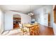 Sunlit dining room featuring an adjacent kitchen and a seamless transition into the living space at 8910 Rutgers St, Westminster, CO 80031