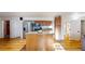Open kitchen with granite island, stainless appliances, and convenient access to all areas at 8910 Rutgers St, Westminster, CO 80031