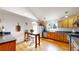 Bright kitchen with stainless steel appliances, wood cabinets, and hardwood floors at 8910 Rutgers St, Westminster, CO 80031