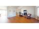 Bright living room with cozy fireplace, vaulted ceilings, and hardwood floors, open to the kitchen at 8910 Rutgers St, Westminster, CO 80031