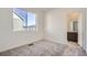Bedroom with gray carpet and en-suite bathroom at 14586 W 91St Ave # A, Arvada, CO 80005