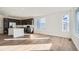 Modern kitchen with dark cabinetry, island, and stainless steel appliances at 14586 W 91St Ave # A, Arvada, CO 80005