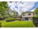 A lush backyard offers ample space for outdoor enjoyment and features beautiful greenery at 3724 S Poplar St, Denver, CO 80237