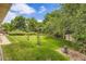 Expansive backyard with lush green grass, mature trees, and well-maintained landscaping offers a serene outdoor retreat at 3724 S Poplar St, Denver, CO 80237