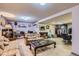 Finished basement with a plaid sofa, desk, carpeted floors, and plenty of space for activities at 3724 S Poplar St, Denver, CO 80237