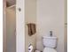Neutral bathroom with a pink-tiled shower and a white toilet with gold hardware accents at 3724 S Poplar St, Denver, CO 80237
