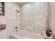 Bathroom shower with a marble design and chrome shower head at 3724 S Poplar St, Denver, CO 80237
