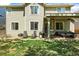 Inviting backyard patio with comfortable seating, grill, and lush green lawn, perfect for outdoor living at 2602 E 145Th Ave, Thornton, CO 80602