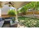 Backyard with an outdoor seating area on a patio and a well-maintained lawn at 2602 E 145Th Ave, Thornton, CO 80602