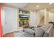 Cozy basement living area featuring a couch, tv, and a stairway at 2602 E 145Th Ave, Thornton, CO 80602