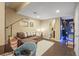 Basement featuring a sectional couch, desk, and a nearby bathroom at 2602 E 145Th Ave, Thornton, CO 80602