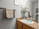 Cozy bathroom features a white sink and decor art pieces at 2602 E 145Th Ave, Thornton, CO 80602