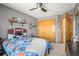 bedroom with a fun football-themed bed, closet, and neutral gray walls at 2602 E 145Th Ave, Thornton, CO 80602