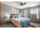 Bright bedroom with a comfortable bed, hardwood furniture, and natural light from the window at 2602 E 145Th Ave, Thornton, CO 80602