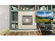 Living room fireplace with decorative tile surround and custom built-in shelving at 2602 E 145Th Ave, Thornton, CO 80602