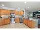 Well-lit kitchen with stainless steel appliances, granite counters, and tile backsplash at 2602 E 145Th Ave, Thornton, CO 80602