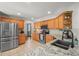 Spacious kitchen featuring granite countertops, stainless steel appliances, and tile flooring at 2602 E 145Th Ave, Thornton, CO 80602