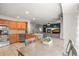 Open-concept living area combining a dining space, living room with fireplace, and a well-equipped kitchen at 2602 E 145Th Ave, Thornton, CO 80602