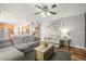 Inviting living room featuring hardwood floors and an open floor plan with a kitchen at 2602 E 145Th Ave, Thornton, CO 80602