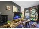 Dark painted office space with computer setup and built in shelving at 2602 E 145Th Ave, Thornton, CO 80602