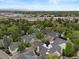 Aerial view of a residential neighborhood with mature trees and well-maintained homes under a blue sky at 4505 S Yosemite St # 362, Denver, CO 80237