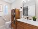 Bathroom with a stylish vanity, modern fixtures, and a unique tile floor pattern at 4505 S Yosemite St # 362, Denver, CO 80237