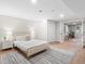 Bright bedroom featuring wood floors, neutral walls, and a doorway to a dining area at 4505 S Yosemite St # 362, Denver, CO 80237
