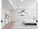 Bedroom featuring wood-look floors, a modern rug and neutral tones at 4505 S Yosemite St # 362, Denver, CO 80237