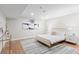 Bedroom featuring wood-look floors, a modern rug, and a full bed at 4505 S Yosemite St # 362, Denver, CO 80237