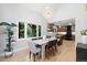 Inviting dining area with natural light, stylish furniture, and kitchen access at 4505 S Yosemite St # 362, Denver, CO 80237