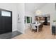 Dining room with hardwood floors, modern lighting, and view into the kitchen at 4505 S Yosemite St # 362, Denver, CO 80237