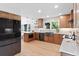 Open kitchen with wood floors, stainless appliances, large sink and beautiful countertops at 4505 S Yosemite St # 362, Denver, CO 80237