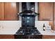 Modern kitchen features stainless steel appliances, custom range hood and beautiful backsplash at 4505 S Yosemite St # 362, Denver, CO 80237