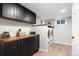 Well-organized laundry room featuring modern appliances, ample storage and wood counters at 4505 S Yosemite St # 362, Denver, CO 80237