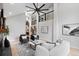 Grand living room with vaulted ceilings, open staircase, and stylish decor at 4505 S Yosemite St # 362, Denver, CO 80237