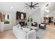 Bright living room with fireplace, ceiling fan, and view into dining room at 4505 S Yosemite St # 362, Denver, CO 80237