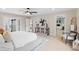 Bright bedroom featuring hardwood floors, a comfortable bed and ensuite bathroom with modern finishes at 4505 S Yosemite St # 362, Denver, CO 80237