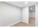 Bright room with a sliding door entrance to another space with wood floors at 4505 S Yosemite St # 362, Denver, CO 80237