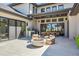 Spacious back patio featuring a fire pit, grill, and outdoor dining at 14545 Lipan St, Westminster, CO 80023