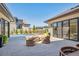 Beautiful back patio with modern fireplace and outdoor seating at 14545 Lipan St, Westminster, CO 80023