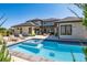 Expansive backyard with pool, spa, patio, and lounge area at 14545 Lipan St, Westminster, CO 80023